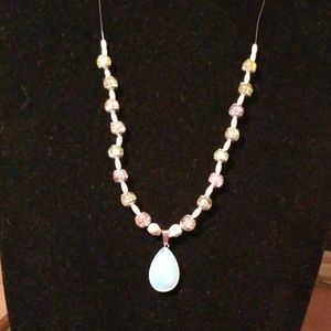 Opaque pendant necklace with small skulls. 24N